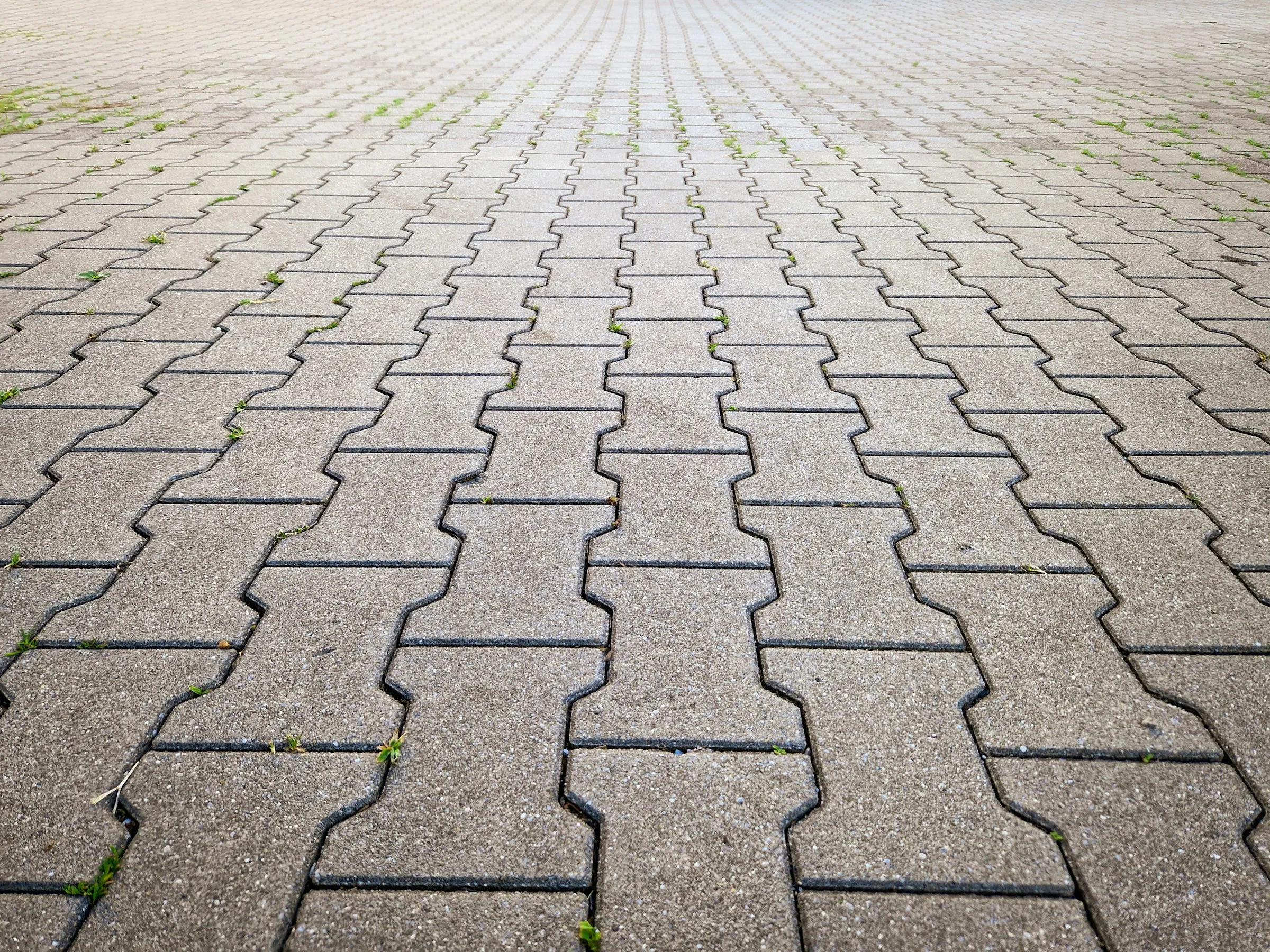 The same driveway after completion: level block paving with kerbs and linear drainage