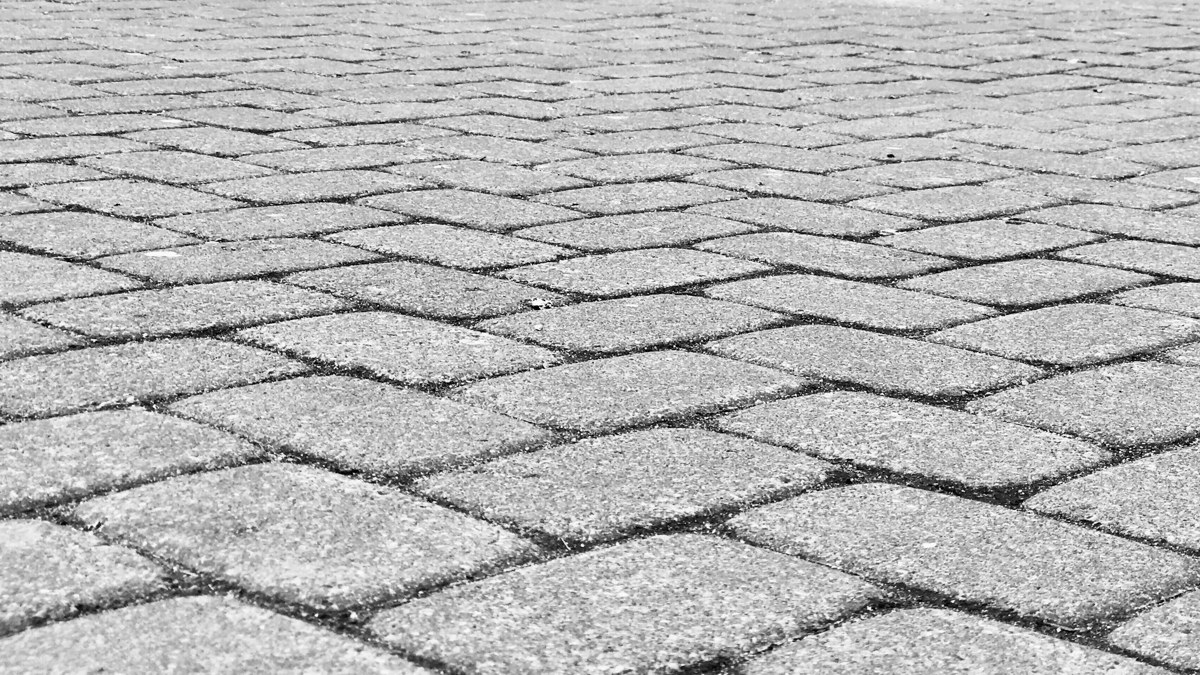 Company car park in block paving with marked parking bays